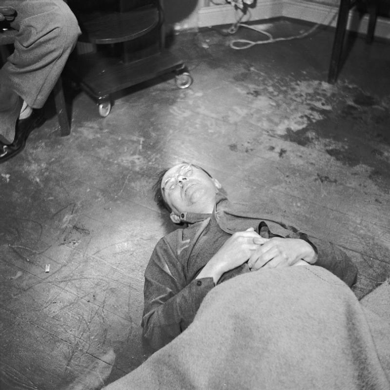 Heinrich Himmler (1900 - 1945): The body of Heinrich Himmler lying on the floor of British 2nd Army HQ after his suicide on 23 May 1945.